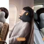 Woman sleeping comfortably on airplane with twisted Dot&Dot memory foam travel pillow supporting neck